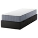 NORDLI black bed frame with drawers and grey mattress.