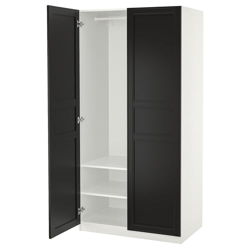 A white PAX wardrobe with black doors, standing vertically. It two open sections with shelves inside.