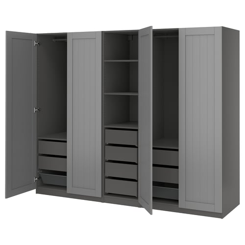 A grey PAX wardrobe with open doors, revealing shelves and drawers inside.