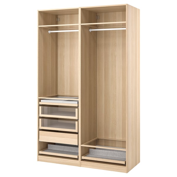 Light wood PAX wardrobe with hanging rail, shelves, and glass-fronted drawers, organised and stylish.