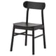 A black RÖNNINGE chair with a wooden seat, curved back, and sleek metal legs. Its simple, vintage-inspired design fits in various settings.