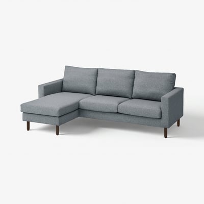 Grey l-shaped couch with sleek legs, soft cushions, and removable cover.