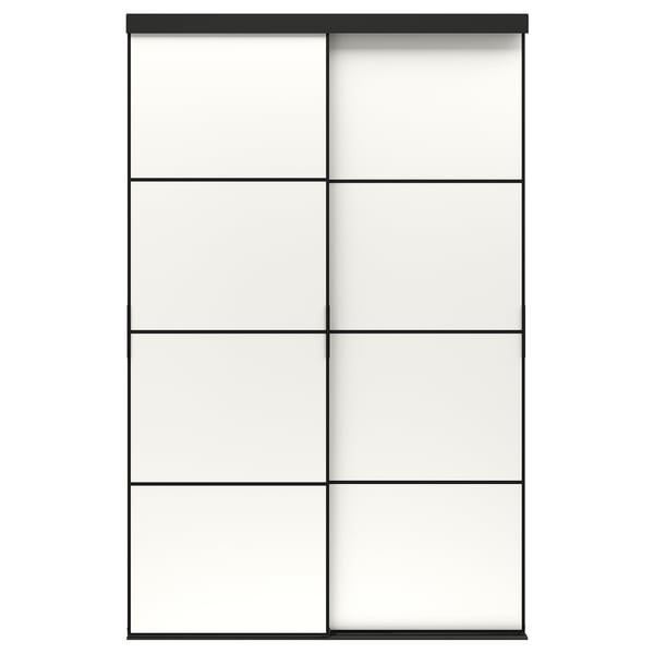 A SKYTTA sliding door in black with frosted glass panels. The modern design an anodized aluminium frame and pine support rails.