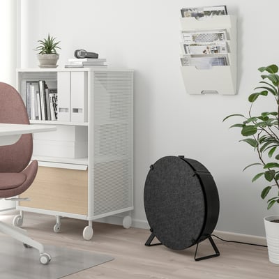 Office with ikea STARKVIND air purifier and bookshelf.