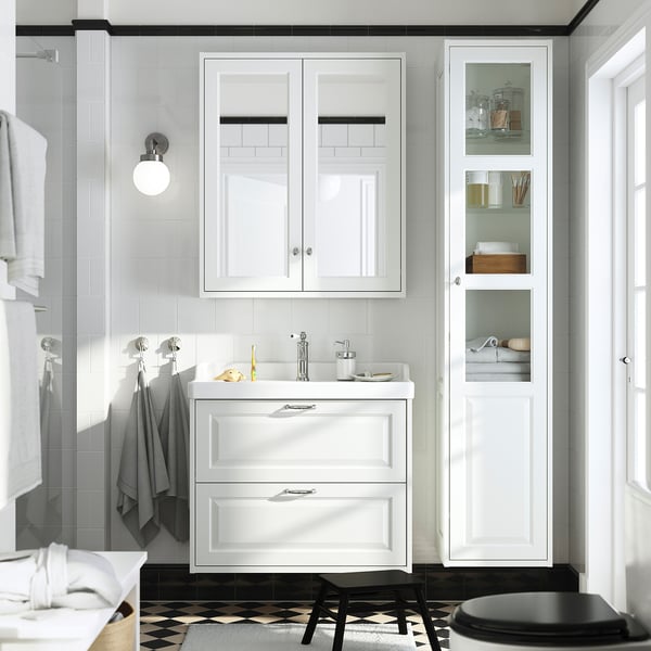 Modern bathroom with TÄNNFORSEN white vanity and large mirror cabinet, dark floor, narrow cabinet.