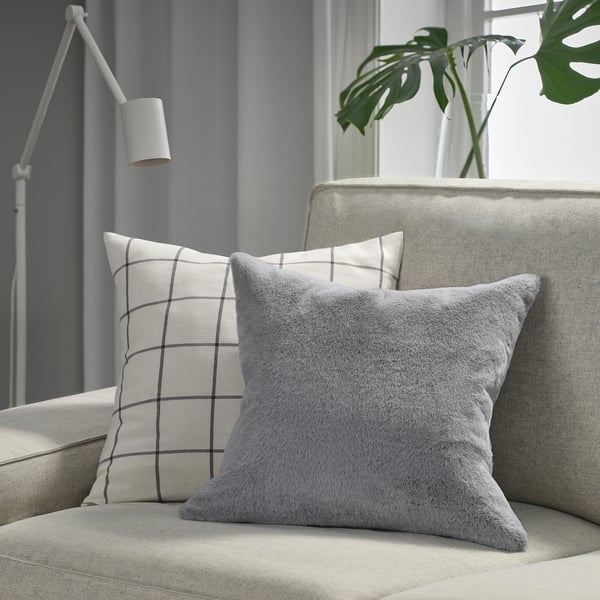 ULLGRIMMIA pillow on couch, grey, plush grid pattern, large, soft recycled polyester.