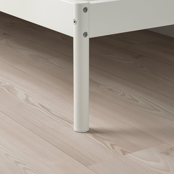 Modern white metal bed leg with screws; sturdy, easy to clean, fits various floor types.