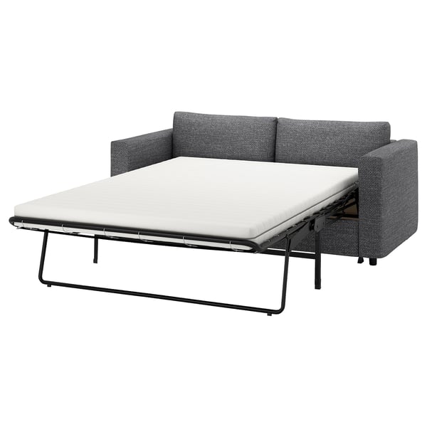 Grey VIMLE sofa-bed, half-open with white mattress, metal frame, neutral design.