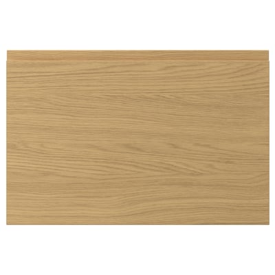 A rectangular oak-finished VOXTORP drawer front with clean lines and integrated handles, featuring a smooth surface and a modern design.