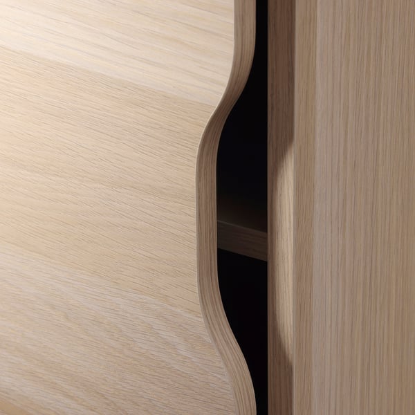 Sleek wooden cabinet door with smooth finish and stylish curves, part of ALEX storage unit.