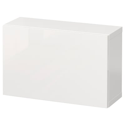 A white BESTÅ storage unit, rectangular and sleek, with a glossy finish and clean lines.