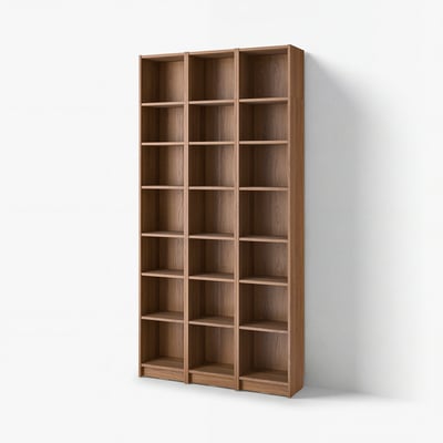 A BILLY bookcase in light brown wood, featuring multiple empty shelves. It stands tall against a light wall.