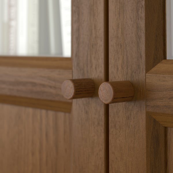 Close-up of wooden BILLY bookcase hinge, showcasing quality craftsmanship and natural finish.