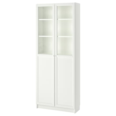 White BILLY bookcase with glass doors, simple and versatile design, adjustable shelves.