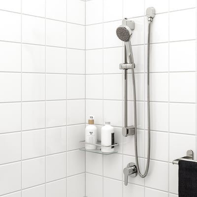 Chrome BROGRUND shower head & rail, stainless rail, handheld showerhead with hose, glass shelf with 2 bottles, black towel.