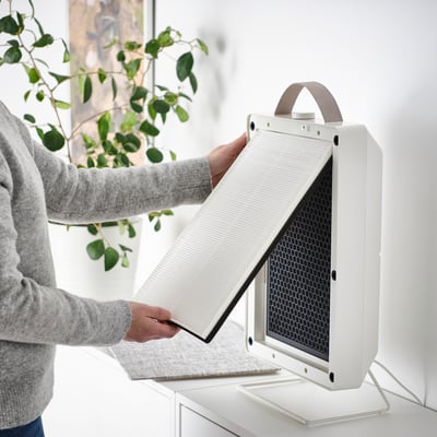 Checking and replacing air purifier philtre.
