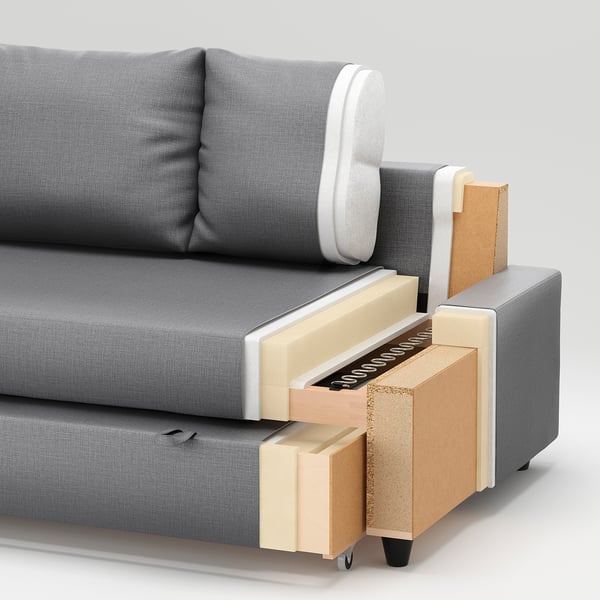Cross-section of a grey sofa showcasing layers: foam, wood, fabric, and metal.