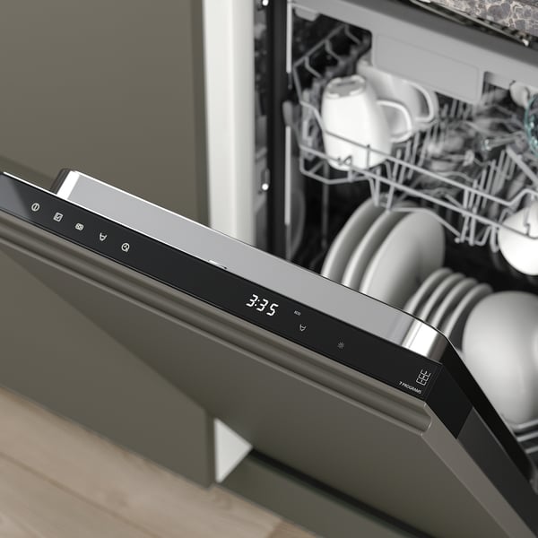 Image depicts a modern built-in dishwasher with digital display showing 3:35. It offers efficient cleaning and adjustable racks.