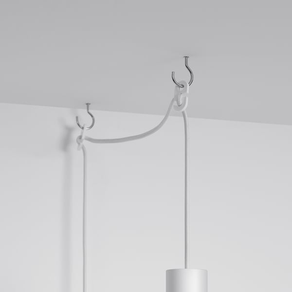 White cord hanger assembly, featuring robust plastic fittings and cord, securely attached to a ceiling or wall, with switches for ease of use.