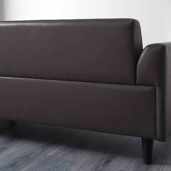 Dark brown leather sofa, modern design, sleek and simple lines, low-profile, clean and contemporary. Perfect for small spaces, easy to maintain.