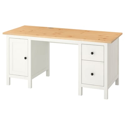 A white HEMNES desk with a light wood top, featuring cabinets and drawers, practical for workspaces.