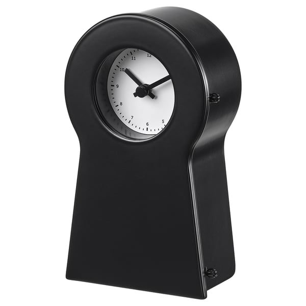 Black IKEA PS 1995 clock with white face, black hands, and steel body.