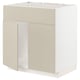 A beige METOD kitchen cabinet with a white interior. It has a rectangular shape with one open door.