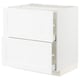 White kitchen cabinet, modern design, with two doors and drawers, containing shelves inside.