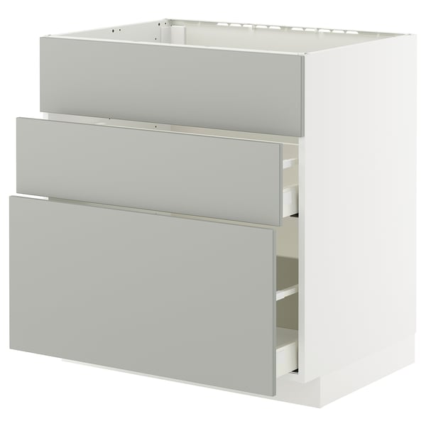 A white METOD kitchen unit with grey havstorp drawers in a modern design.