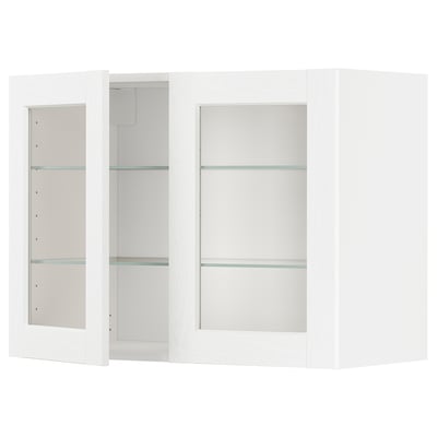 Its a white METOD kitchen cabinet with glass doors, featuring a modern design and adjustable shelves.