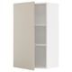 White METOD kitchen cabinet with beige door open, rectangular shape, smooth clean look.