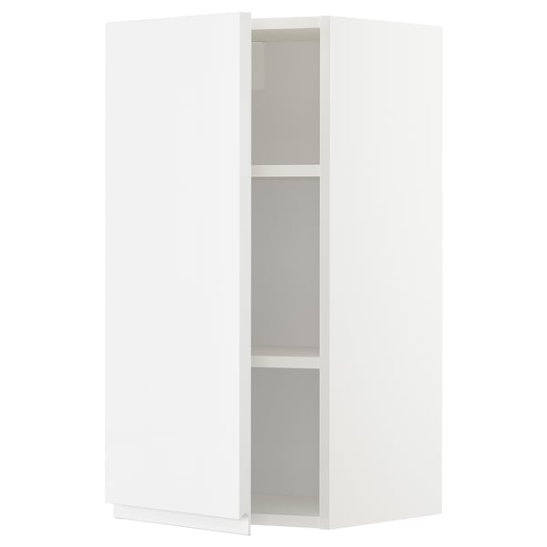 White METOD kitchen cabinet, open door, adjustable shelf.