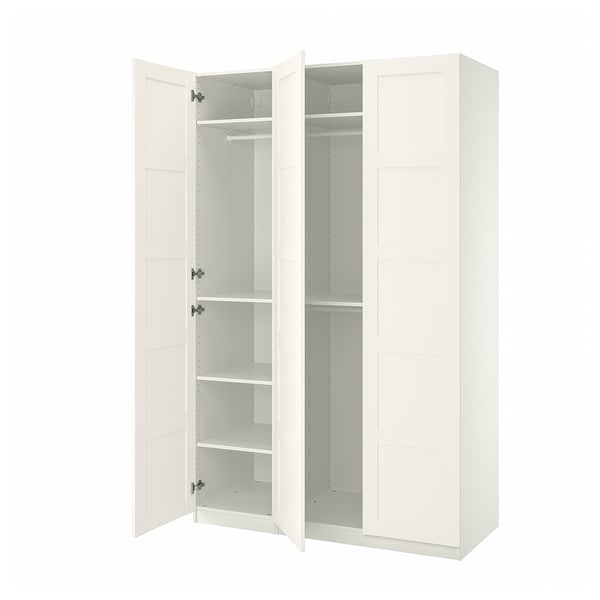 White ikea PAX wardrobe, tall, square, two doors open revealing shelves.