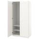 White PAX wardrobe with open doors, showing metal hang rail and shelves.
