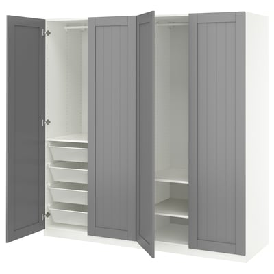 An open grey PAX wardrobe with pull-out baskets and shelves. It a sleek design and organised storage solutions.