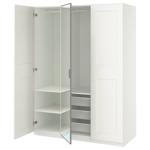 An open white PAX wardrobe with shelves and a mesh basket.