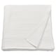 A white, folded single bedspread made of 100% cotton with a reversible waffle weave texture.