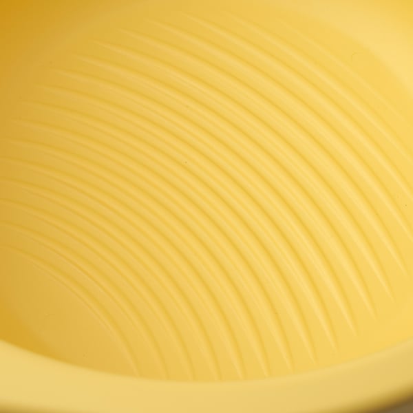 Yellow foldable plastic tub, grooved for scrubbing, spreads flat for storage.