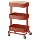 A red, two-tier storage trolley with wheels and a wooden top. Its compact and mobile, ideal for small spaces.