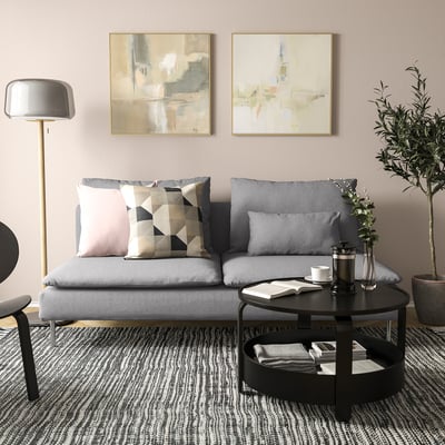 Modern living room: grey SÖDERHAMN sofa, pillows, coffee table, lamp, art, plant.