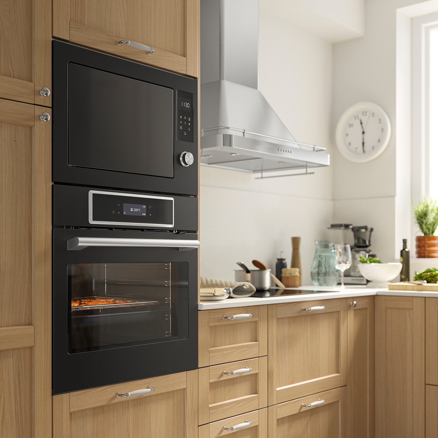 Modern kitchen with black IKEA STENABY oven, microwave, & digital display in wooden cabinets. Well-lit with white countertop & clock.