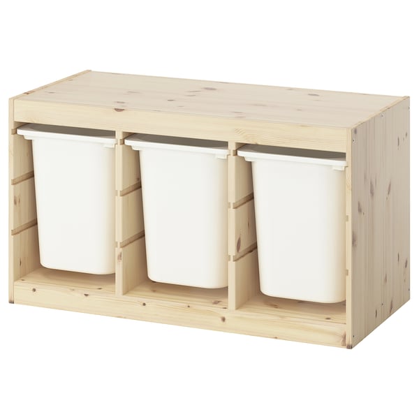 TROFAST light wooden storage with three white plastic bins. Its light-colored with a rectangular design.