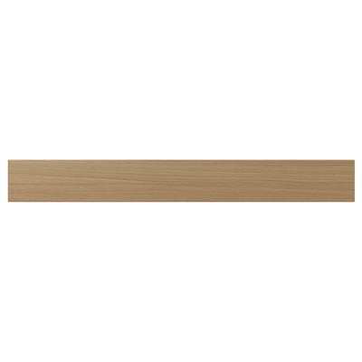 A VEDHAMN kitchen drawer front in natural wood. It is rectangular with visible oak grain, framed by solid wood, and lacquered for durability.