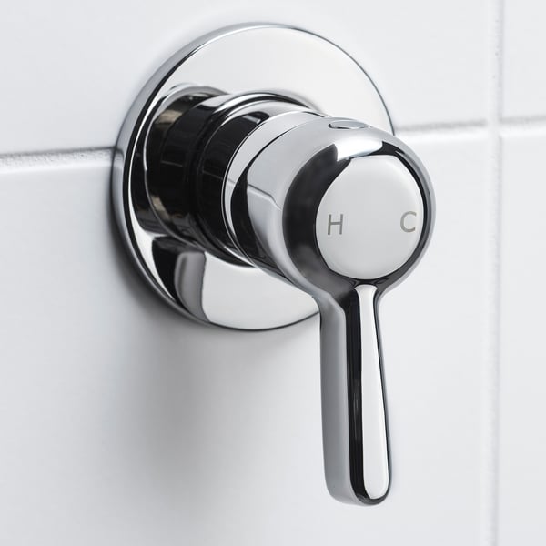 Shower mixer handle, controls water flow and temperature.