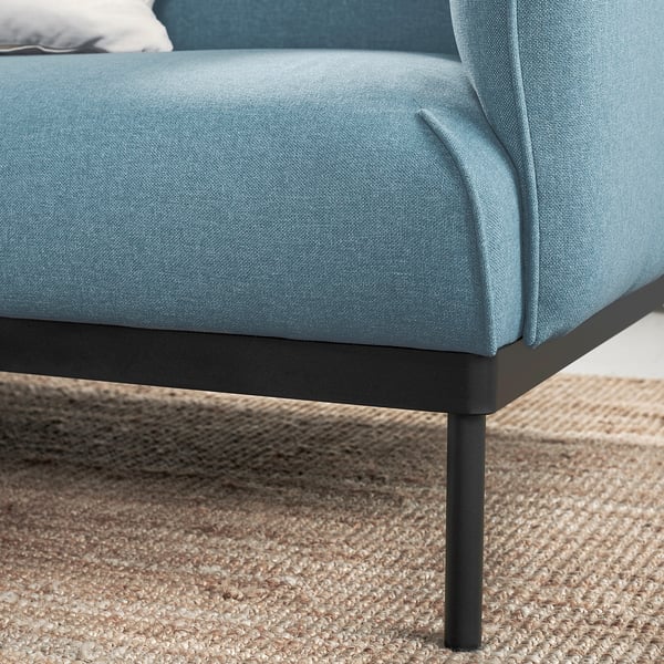 Aqua blue modern sofa with sturdy metal legs.