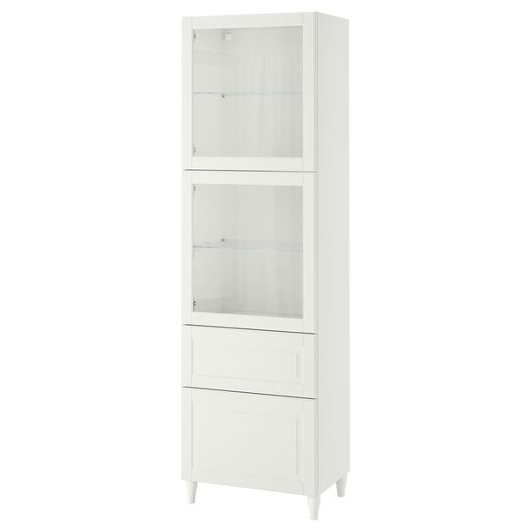 White BESTÅ cabinet with glass doors and drawers for storage and display.