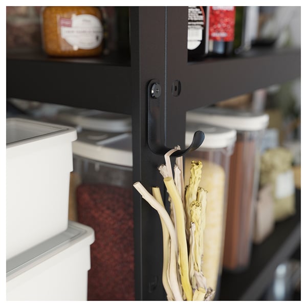Black BROR storage hooks hold white onions in a kitchen, showcasing organisers sleek design.