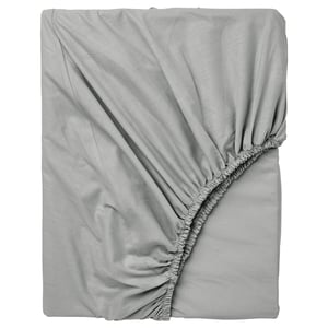 Grey DVALA cotton fitted sheet, soft, elastic edges, flat layout.