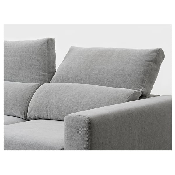 A modern, comfortable sofa with adjustable headrests and chaise lounge, upholstered in light grey fabric.