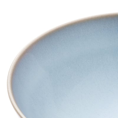Handcrafted blue stoneware plate with smooth, rustic finish.